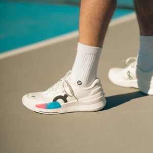White blue and pink tennis shoe